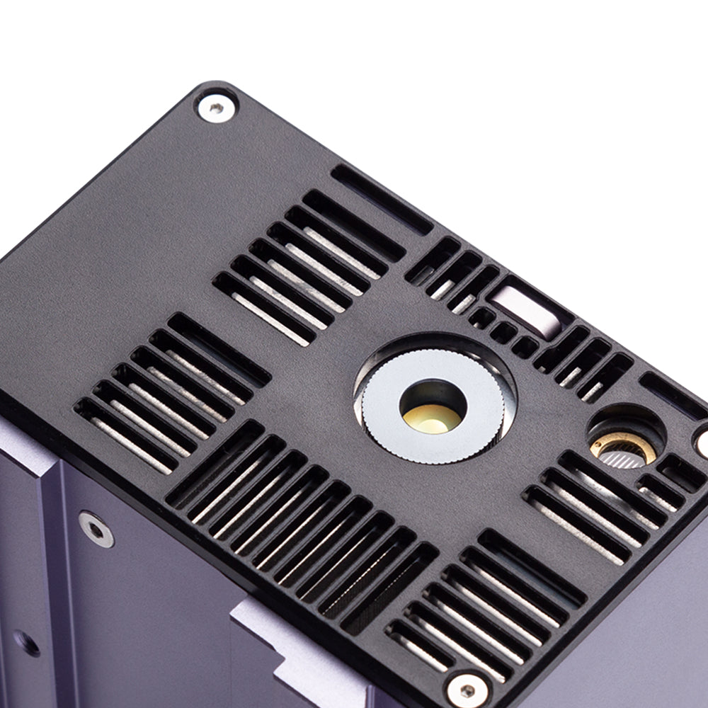 Close-up of the Snapmaker 1064nm IR Laser Module's underside showing mount points and laser aperture.